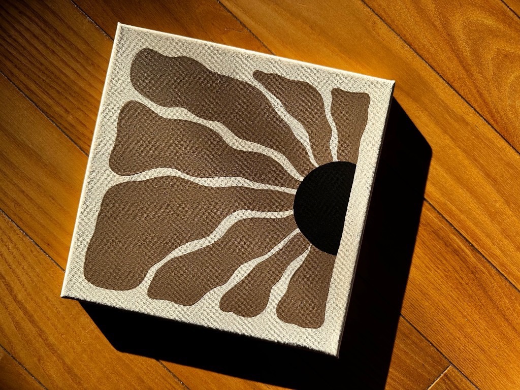 Sunlit Botanicals sunburst floral painting on wood floor
